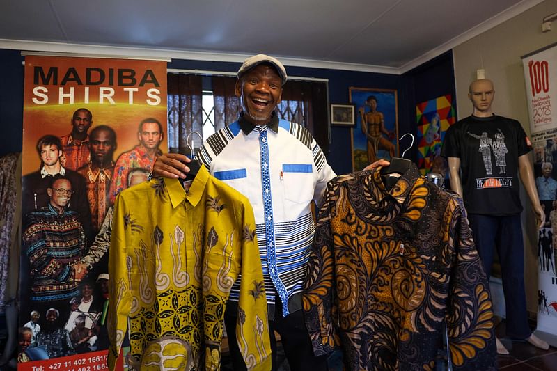 Sonwabile Ndamase, who used to design and style for the late former President of South Africa Nelson Mandela and the designer of the original Madiba shirt, shows some of his latest designs in his studio in Johannesburg on 4 July, 2024